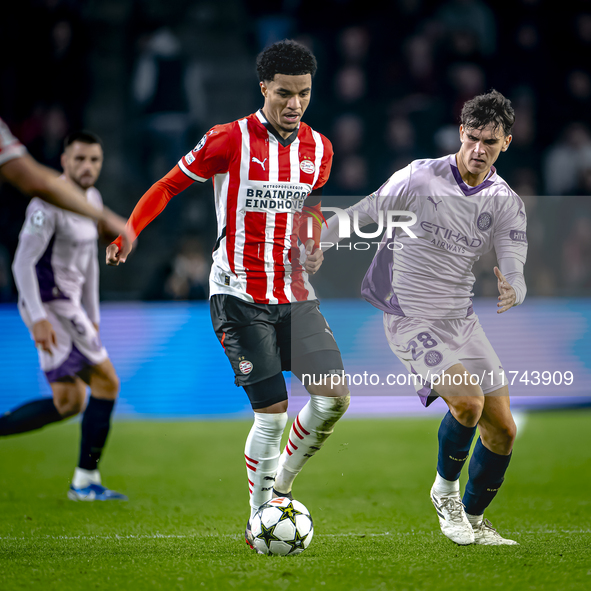 PSV Eindhoven midfielder Malik Tillman and Girona FC midfielder Silvi Clua play during the match between PSV and Girona at the Philips Stadi...