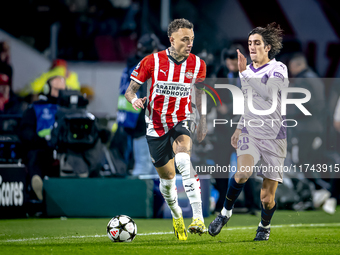 PSV Eindhoven forward Noa Lang and Girona FC forward Bryan Gil play during the match between PSV and Girona at the Philips Stadium for the U...