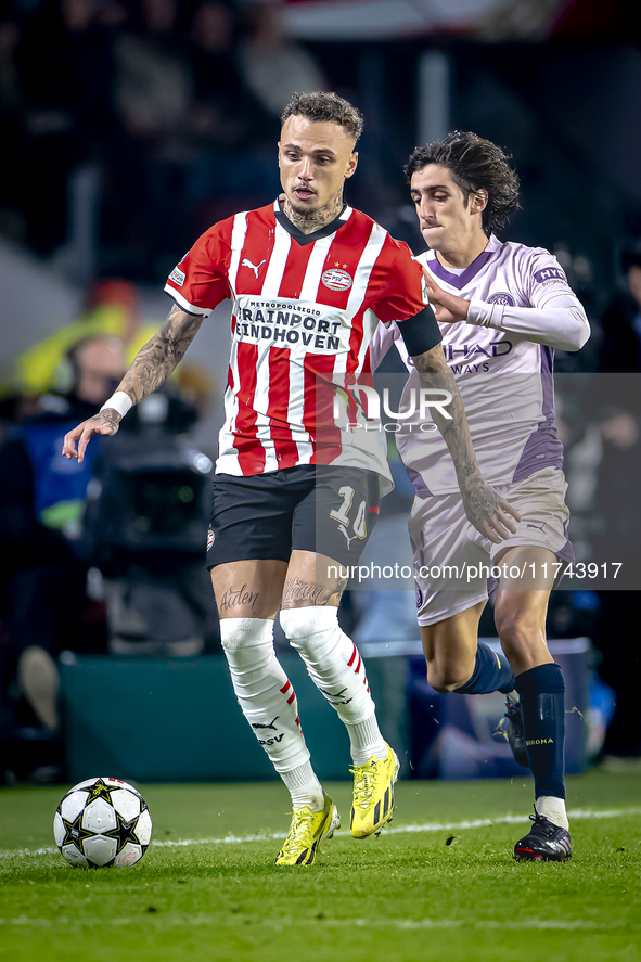 PSV Eindhoven forward Noa Lang and Girona FC forward Bryan Gil play during the match between PSV and Girona at the Philips Stadium for the U...