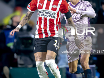 PSV Eindhoven forward Noa Lang and Girona FC forward Bryan Gil play during the match between PSV and Girona at the Philips Stadium for the U...