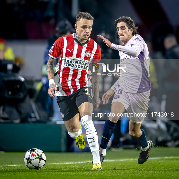 PSV Eindhoven forward Noa Lang and Girona FC forward Bryan Gil play during the match between PSV and Girona at the Philips Stadium for the U...