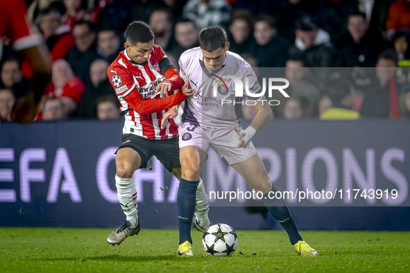 PSV Eindhoven defender Mauro Junior and Girona FC defender Miguel Gutierrez play during the match between PSV and Girona at the Philips Stad...