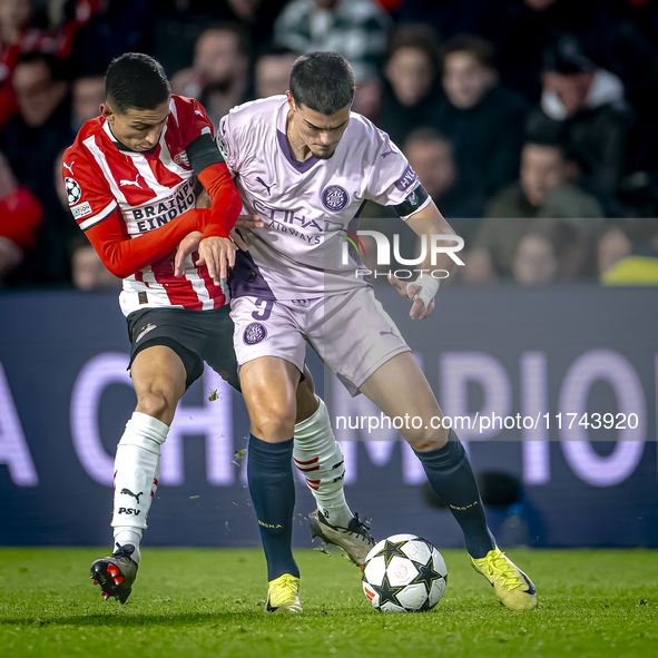 PSV Eindhoven defender Mauro Junior and Girona FC defender Miguel Gutierrez play during the match between PSV and Girona at the Philips Stad...