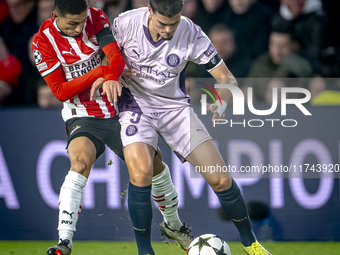 PSV Eindhoven defender Mauro Junior and Girona FC defender Miguel Gutierrez play during the match between PSV and Girona at the Philips Stad...