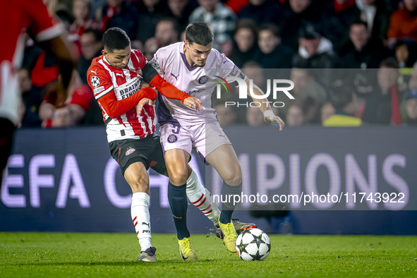 PSV Eindhoven defender Mauro Junior and Girona FC defender Miguel Gutierrez play during the match between PSV and Girona at the Philips Stad...