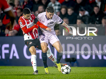 PSV Eindhoven defender Mauro Junior and Girona FC defender Miguel Gutierrez play during the match between PSV and Girona at the Philips Stad...