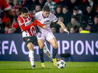 PSV Eindhoven defender Mauro Junior and Girona FC defender Miguel Gutierrez play during the match between PSV and Girona at the Philips Stad...