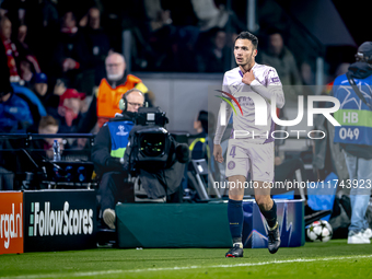 Girona FC defender Arnau Martinez receives a red card and leaves the pitch during the match between PSV and Girona at the Philips Stadium fo...