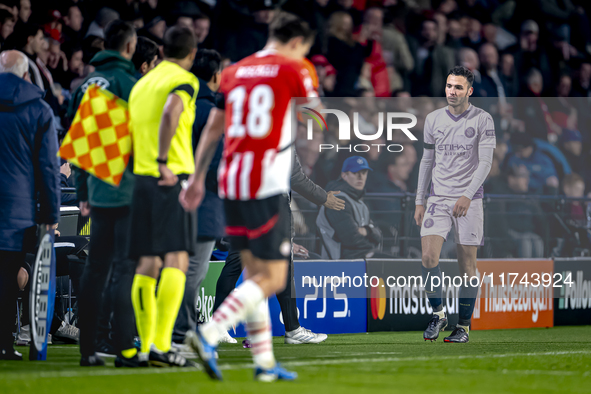 Girona FC defender Arnau Martinez receives a red card and leaves the pitch during the match between PSV and Girona at the Philips Stadium fo...