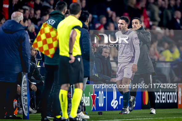 Girona FC defender Arnau Martinez receives a red card and leaves the pitch during the match between PSV and Girona at the Philips Stadium fo...