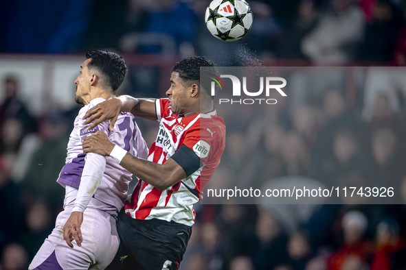 Girona FC forward Bojan Miovski and PSV Eindhoven defender Ryan Flamingo play during the match between PSV and Girona at the Philips Stadium...