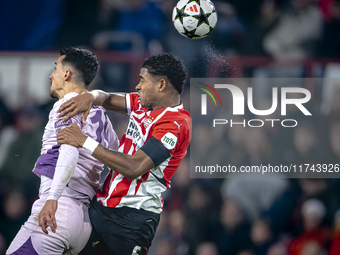 Girona FC forward Bojan Miovski and PSV Eindhoven defender Ryan Flamingo play during the match between PSV and Girona at the Philips Stadium...