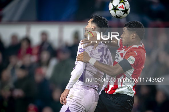 Girona FC forward Bojan Miovski and PSV Eindhoven defender Ryan Flamingo play during the match between PSV and Girona at the Philips Stadium...