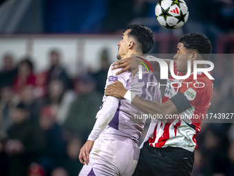 Girona FC forward Bojan Miovski and PSV Eindhoven defender Ryan Flamingo play during the match between PSV and Girona at the Philips Stadium...