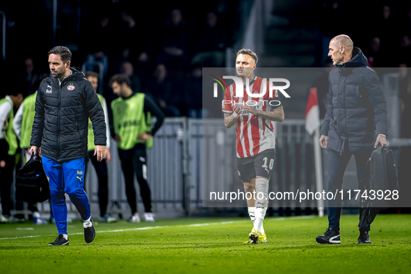 PSV Eindhoven forward Noa Lang becomes injured and leaves the pitch during the match between PSV and Girona at the Philips Stadium for the U...