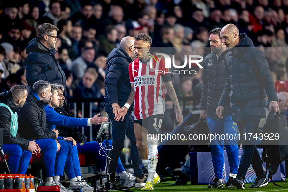 PSV Eindhoven forward Noa Lang becomes injured and leaves the pitch during the match between PSV and Girona at the Philips Stadium for the U...