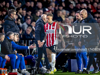 PSV Eindhoven forward Noa Lang becomes injured and leaves the pitch during the match between PSV and Girona at the Philips Stadium for the U...