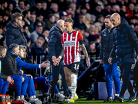 PSV Eindhoven forward Noa Lang becomes injured and leaves the pitch during the match between PSV and Girona at the Philips Stadium for the U...