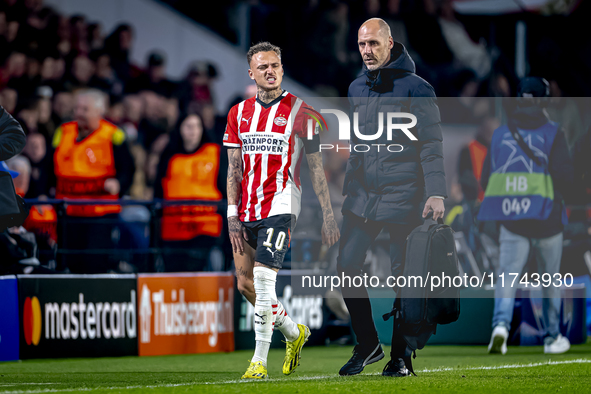 PSV Eindhoven forward Noa Lang becomes injured and leaves the pitch during the match between PSV and Girona at the Philips Stadium for the U...