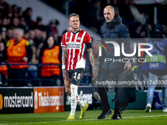 PSV Eindhoven forward Noa Lang becomes injured and leaves the pitch during the match between PSV and Girona at the Philips Stadium for the U...