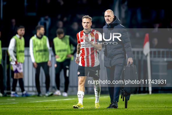 PSV Eindhoven forward Noa Lang becomes injured and leaves the pitch during the match between PSV and Girona at the Philips Stadium for the U...