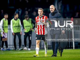 PSV Eindhoven forward Noa Lang becomes injured and leaves the pitch during the match between PSV and Girona at the Philips Stadium for the U...