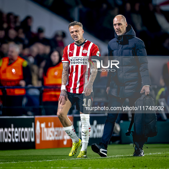 PSV Eindhoven forward Noa Lang becomes injured and leaves the pitch during the match between PSV and Girona at the Philips Stadium for the U...