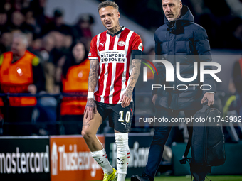 PSV Eindhoven forward Noa Lang becomes injured and leaves the pitch during the match between PSV and Girona at the Philips Stadium for the U...