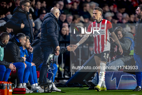 PSV Eindhoven forward Noa Lang becomes injured and leaves the pitch during the match between PSV and Girona at the Philips Stadium for the U...