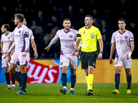 Girona FC defender David Lopez and referee Michael Oliver participate in the match between PSV and Girona at the Philips Stadium for the UEF...