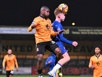 Amaru Kaunda (37, Cambridge United) challenges Brodie Hughes (44, Chelsea) during the EFL Trophy match between Cambridge United and Chelsea...