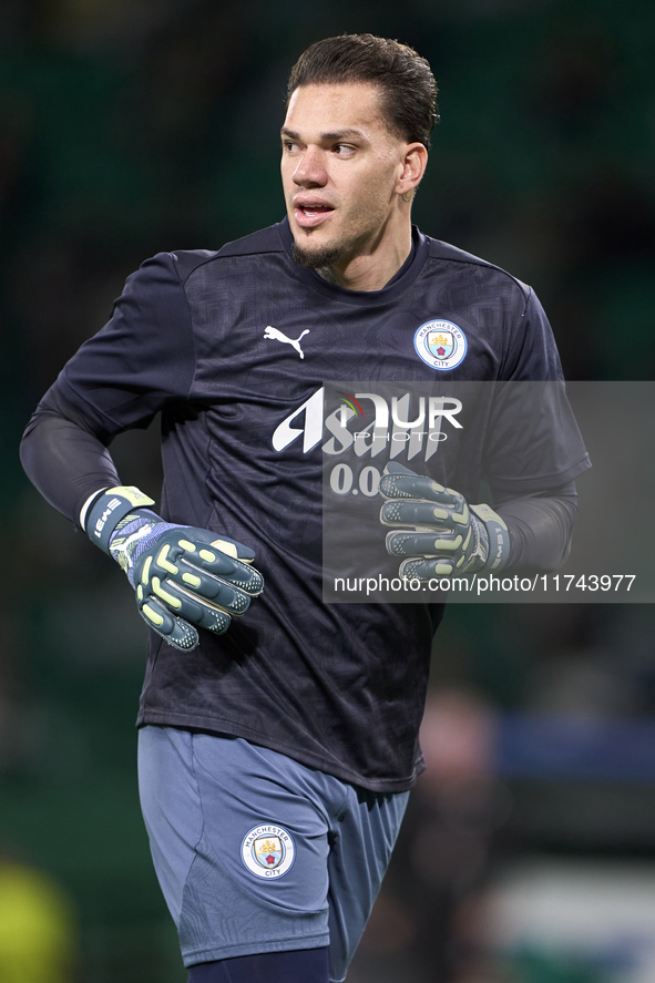 Ederson of Manchester City warms up before the UEFA Champions League match between Sporting CP and Manchester City at Jose Alvalade Stadium...