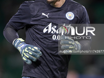 Ederson of Manchester City warms up before the UEFA Champions League match between Sporting CP and Manchester City at Jose Alvalade Stadium...