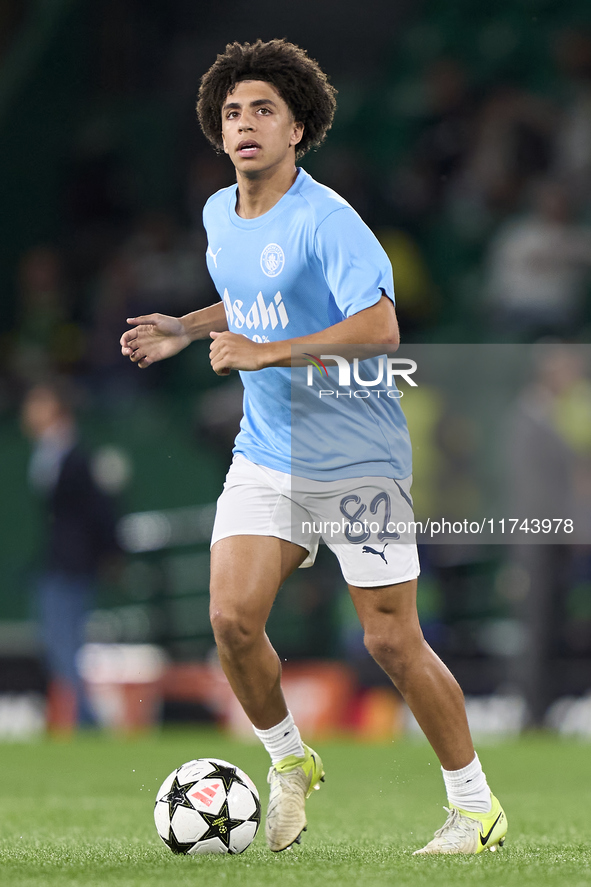 Rico Lewis of Manchester City warms up before the UEFA Champions League match between Sporting CP and Manchester City at Jose Alvalade Stadi...