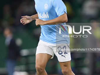 Rico Lewis of Manchester City warms up before the UEFA Champions League match between Sporting CP and Manchester City at Jose Alvalade Stadi...