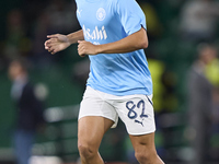 Rico Lewis of Manchester City warms up before the UEFA Champions League match between Sporting CP and Manchester City at Jose Alvalade Stadi...