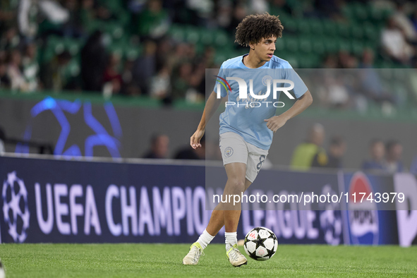 Rico Lewis of Manchester City warms up before the UEFA Champions League match between Sporting CP and Manchester City at Jose Alvalade Stadi...