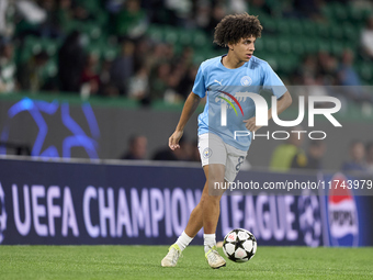 Rico Lewis of Manchester City warms up before the UEFA Champions League match between Sporting CP and Manchester City at Jose Alvalade Stadi...