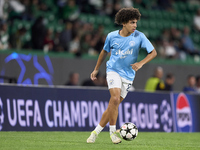 Rico Lewis of Manchester City warms up before the UEFA Champions League match between Sporting CP and Manchester City at Jose Alvalade Stadi...