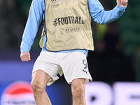 Erling Haaland of Manchester City warms up before the UEFA Champions League match between Sporting CP and Manchester City at Jose Alvalade S...