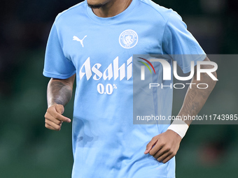 Savinho of Manchester City warms up before the UEFA Champions League match between Sporting CP and Manchester City at Jose Alvalade Stadium...