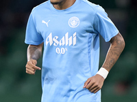 Savinho of Manchester City warms up before the UEFA Champions League match between Sporting CP and Manchester City at Jose Alvalade Stadium...