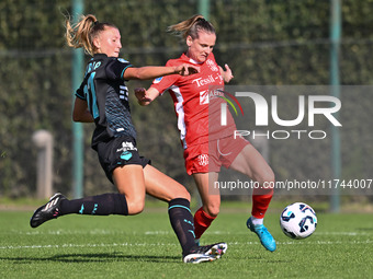 Federica D'Auria of S.S. Lazio and Mina Bergersen of F.C. Como Women participate in the round of 16 of the Coppa Italia Femminile between S....