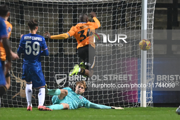 Goalkeeper Lucas Bergstrom (47 Chelsea) saves from Brandon Njoku (34 Cambridge United) during the EFL Trophy match between Cambridge United...