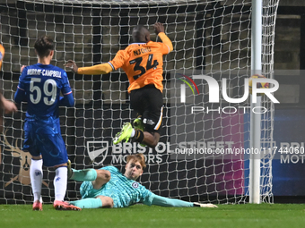 Goalkeeper Lucas Bergstrom (47 Chelsea) saves from Brandon Njoku (34 Cambridge United) during the EFL Trophy match between Cambridge United...