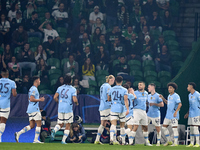 Phil Foden of Manchester City celebrates with his teammates after scoring his team's first goal during the UEFA Champions League match betwe...