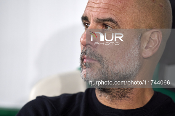 Pep Guardiola, Head Coach of Manchester City, looks on prior to the UEFA Champions League match between Sporting CP and Manchester City at J...