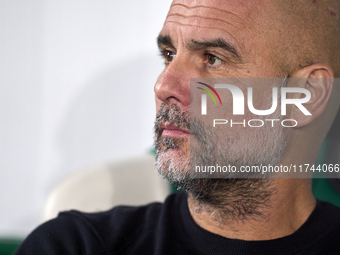 Pep Guardiola, Head Coach of Manchester City, looks on prior to the UEFA Champions League match between Sporting CP and Manchester City at J...