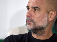 Pep Guardiola, Head Coach of Manchester City, looks on prior to the UEFA Champions League match between Sporting CP and Manchester City at J...