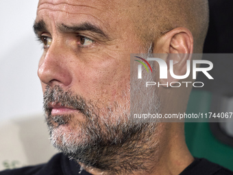 Pep Guardiola, Head Coach of Manchester City, looks on prior to the UEFA Champions League match between Sporting CP and Manchester City at J...